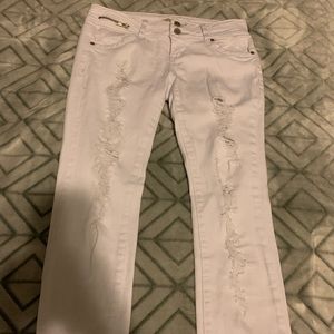 Distressed white jeans